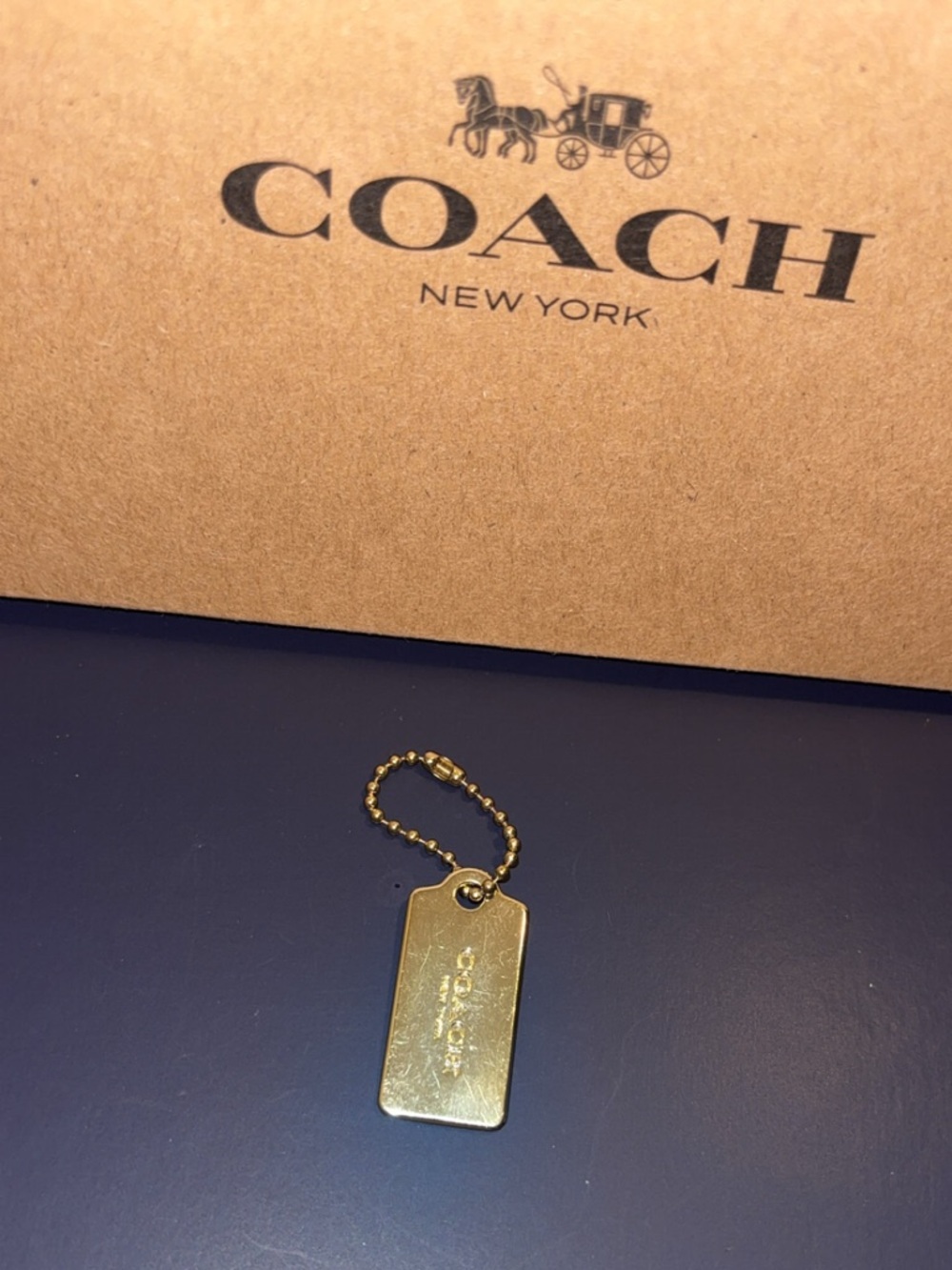 Coach mini Gold hang tag
